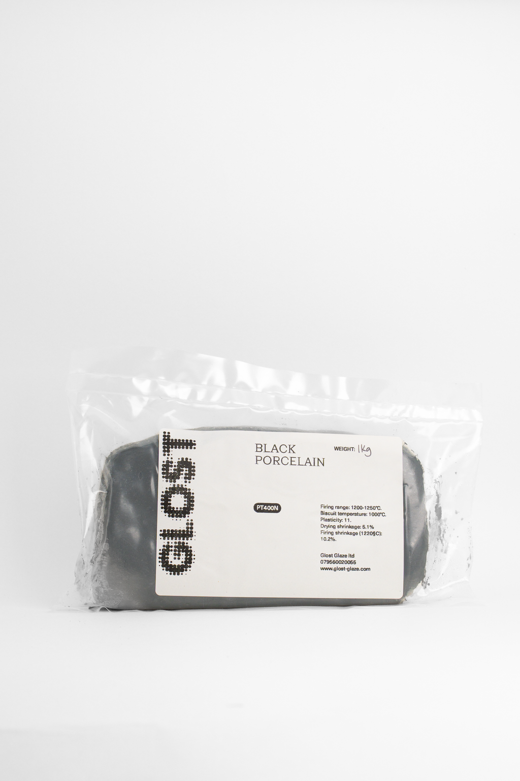 A 1kg bag of GLOST Black Ice porcelain, dark grey clay behind the printed label