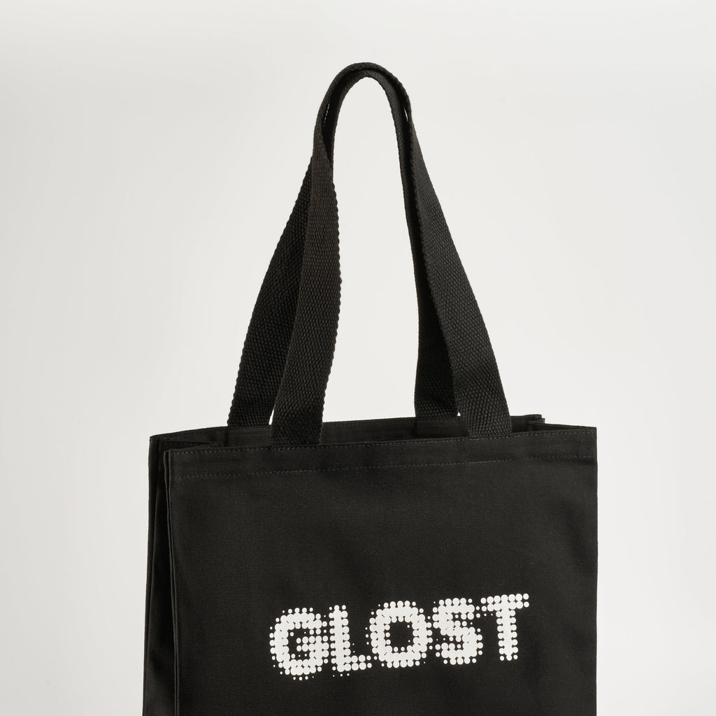 GLOST black cotton tote bag with the logo printed in white