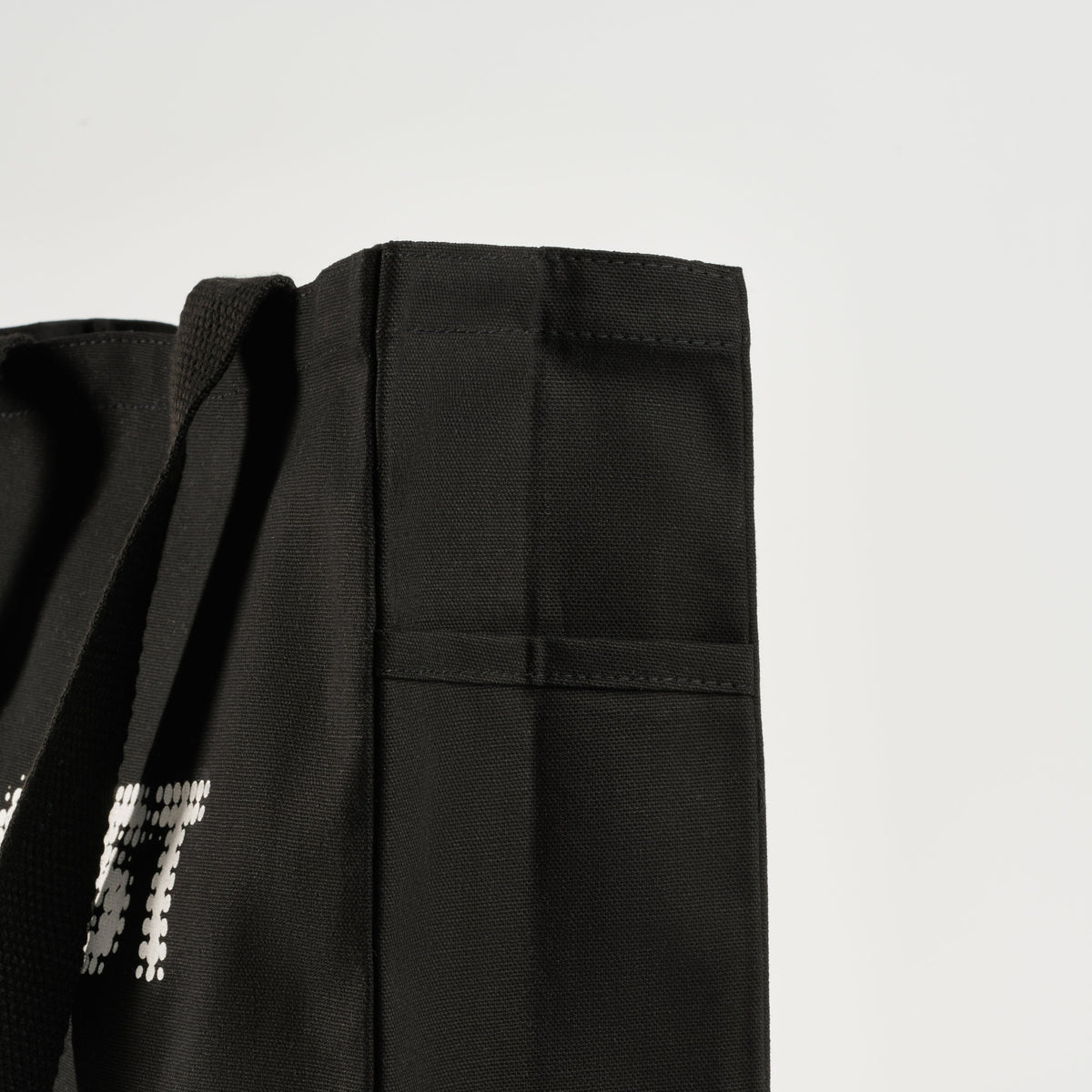 GLOST black cotton tote bags, folded