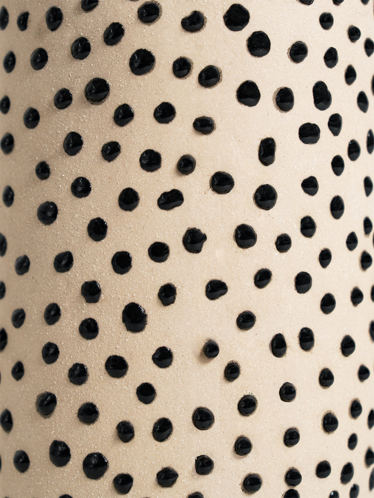 Versatile Liquid Gloop ceramic glaze in black, designed for achieving intricate textures and raised patterns on pottery.