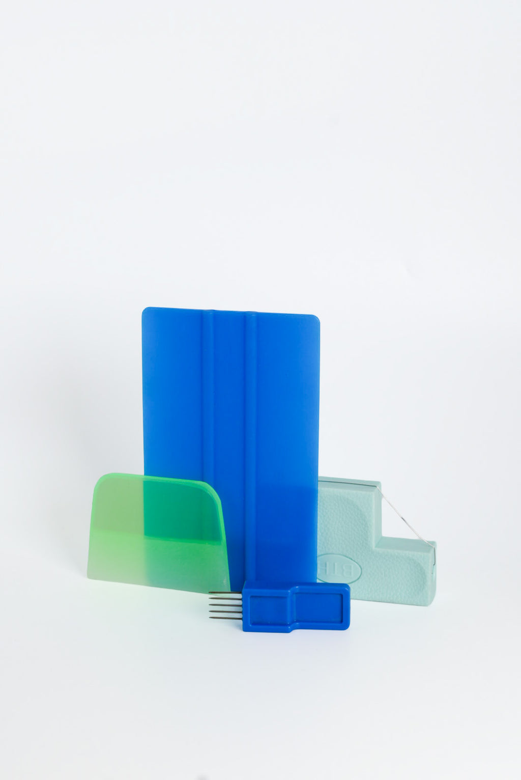 The handbuilding tools from the GLOST set arranged together.