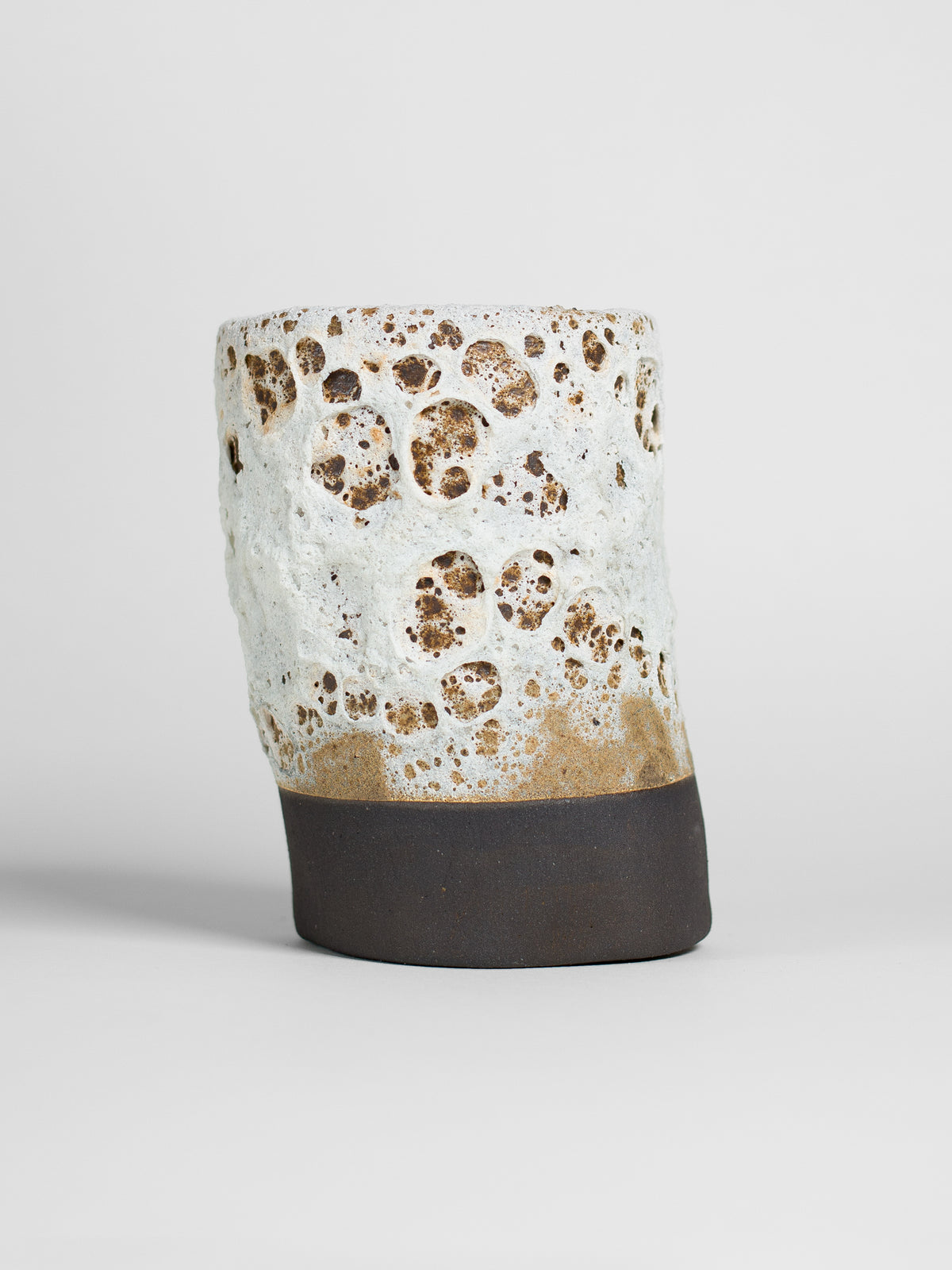 White Lava brush-on glaze creating dimensional volcanic textures, perfect for sculptural ceramics and relief surface effects.