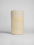 Green Liquid Gloop glaze on a test cylinder, green droplets over a cream ground