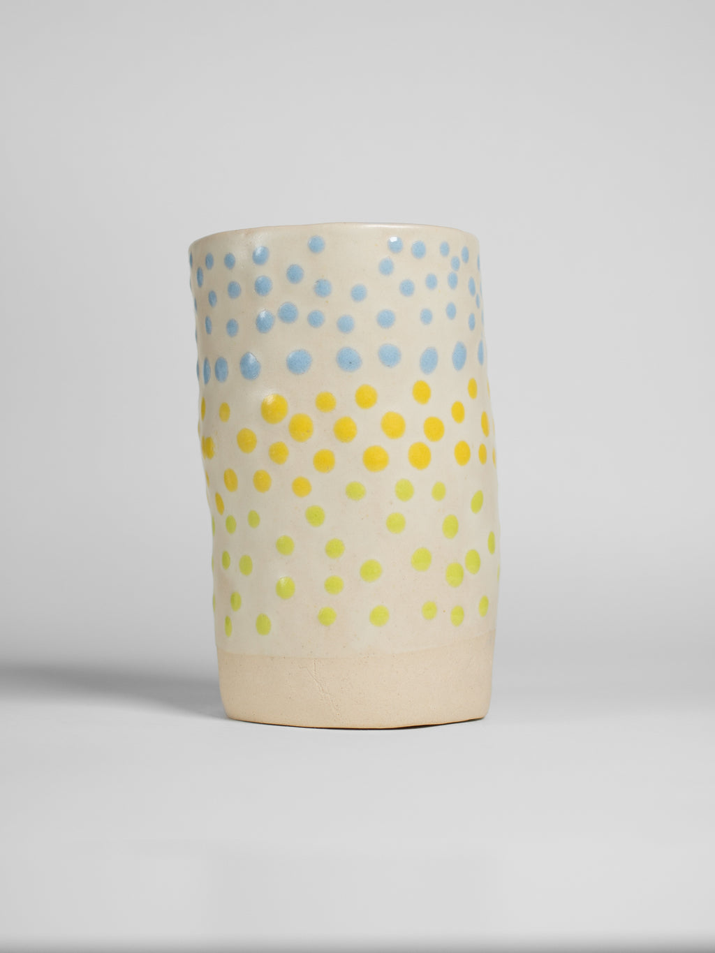 Yellow Liquid Gloop on a pale fired test cylinder