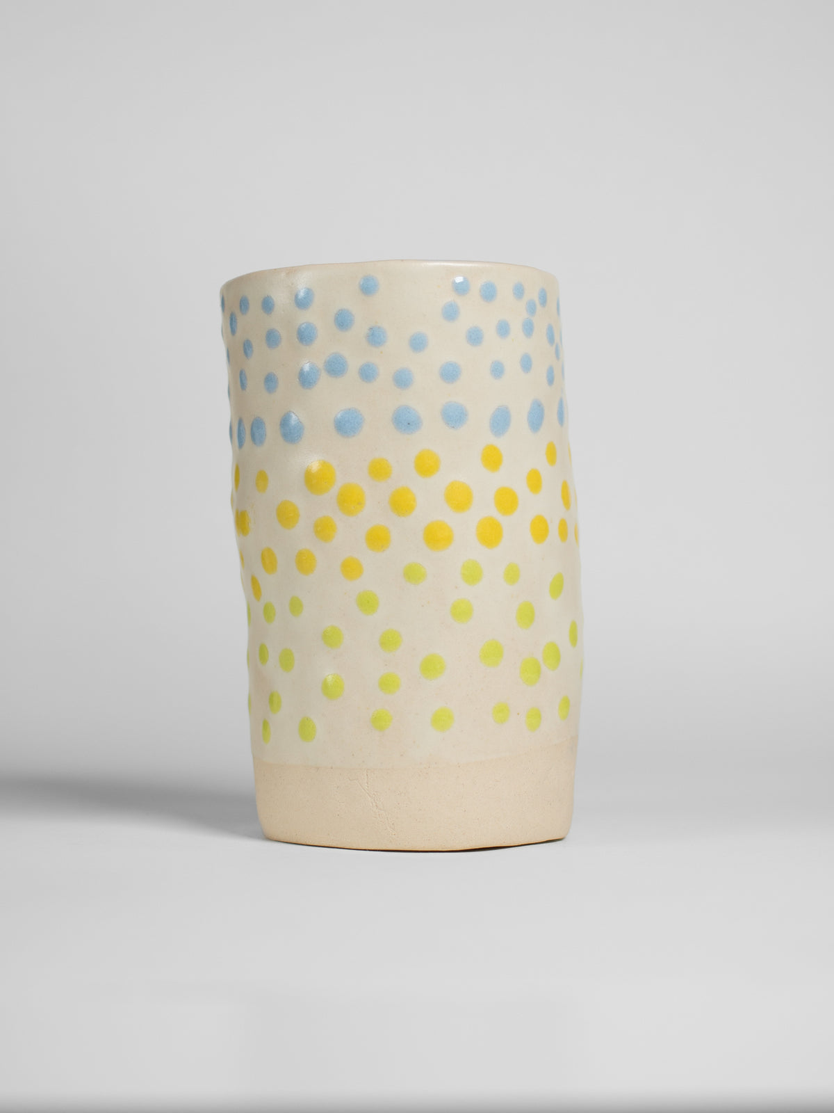Yellow Liquid Gloop on a pale fired test cylinder
