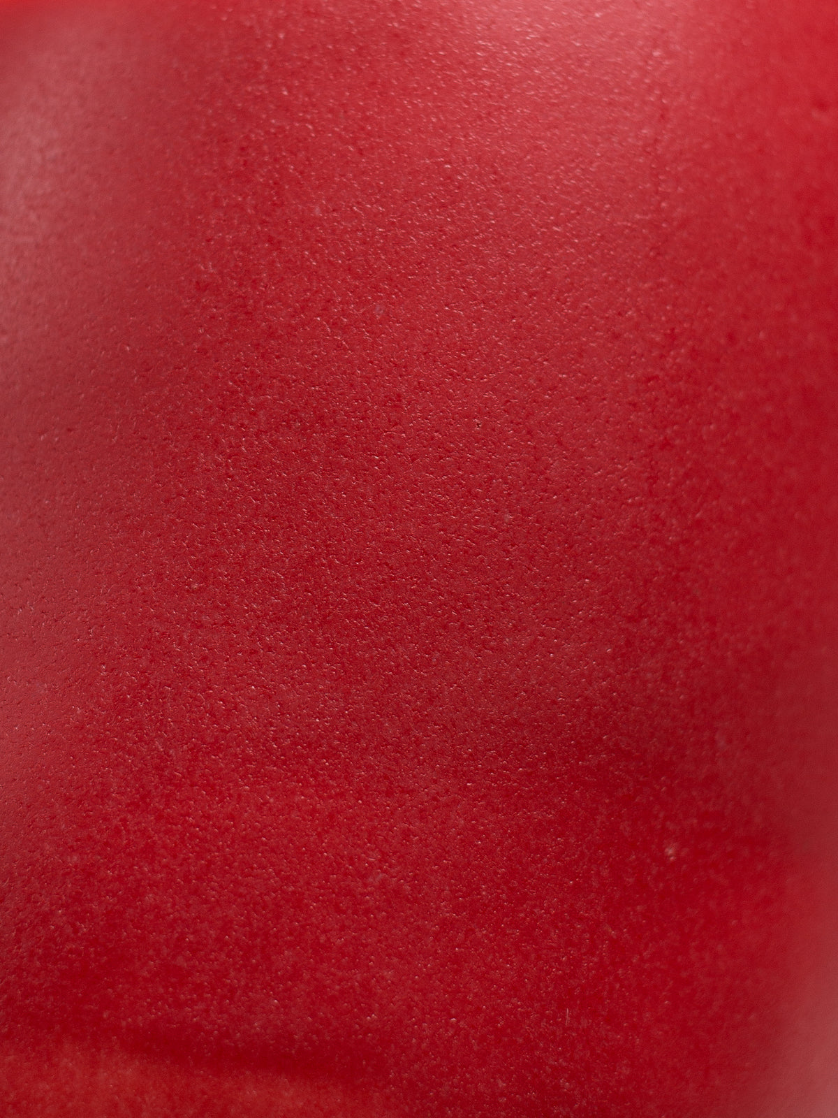 Close up of Hot Red Pastel Dreams, a deep red matt surface