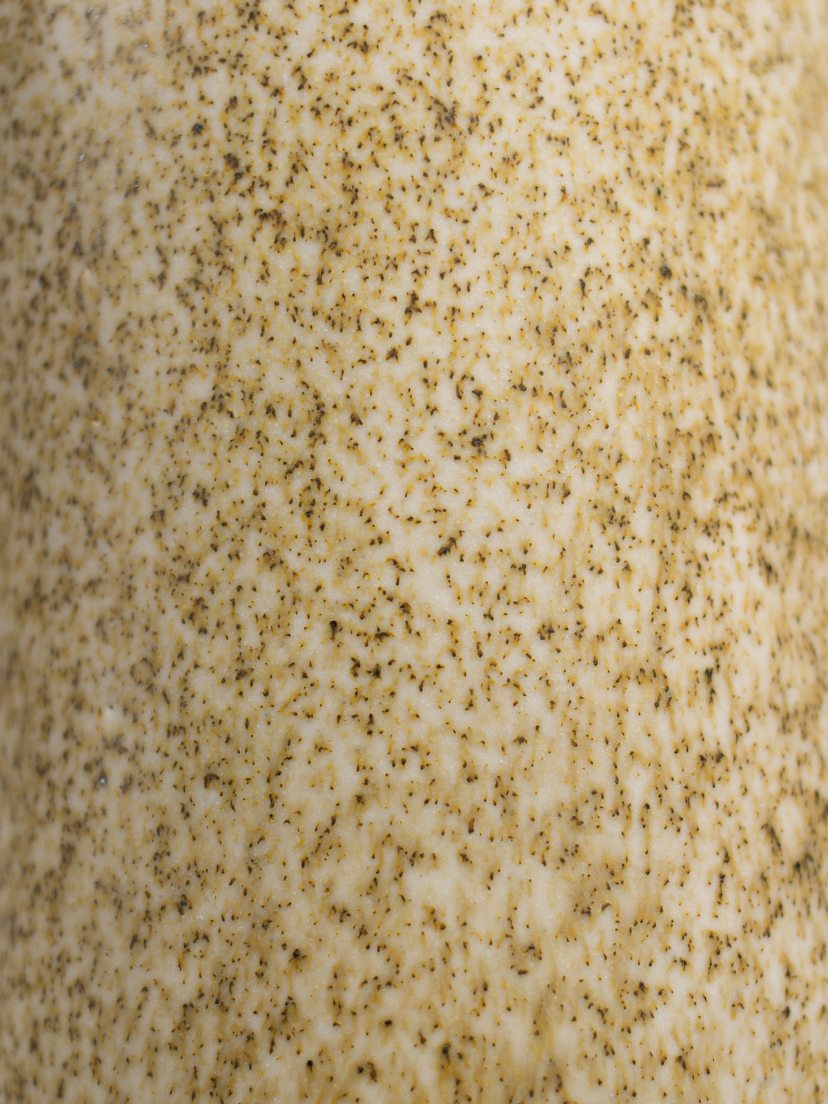 Close up of Speckle Matt glaze, an oatmeal matt surface with dark speckles