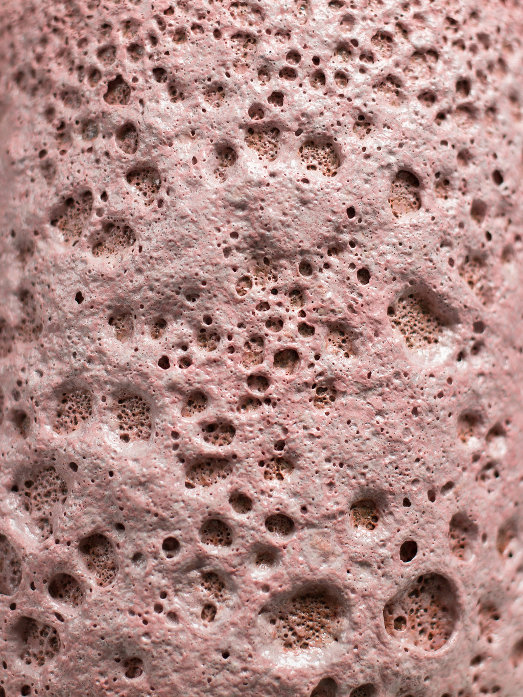 Pink Lava brush-on glaze applied to ceramics, highlighting its tactile, lava-like texture and gradient shades from light to deep pink.