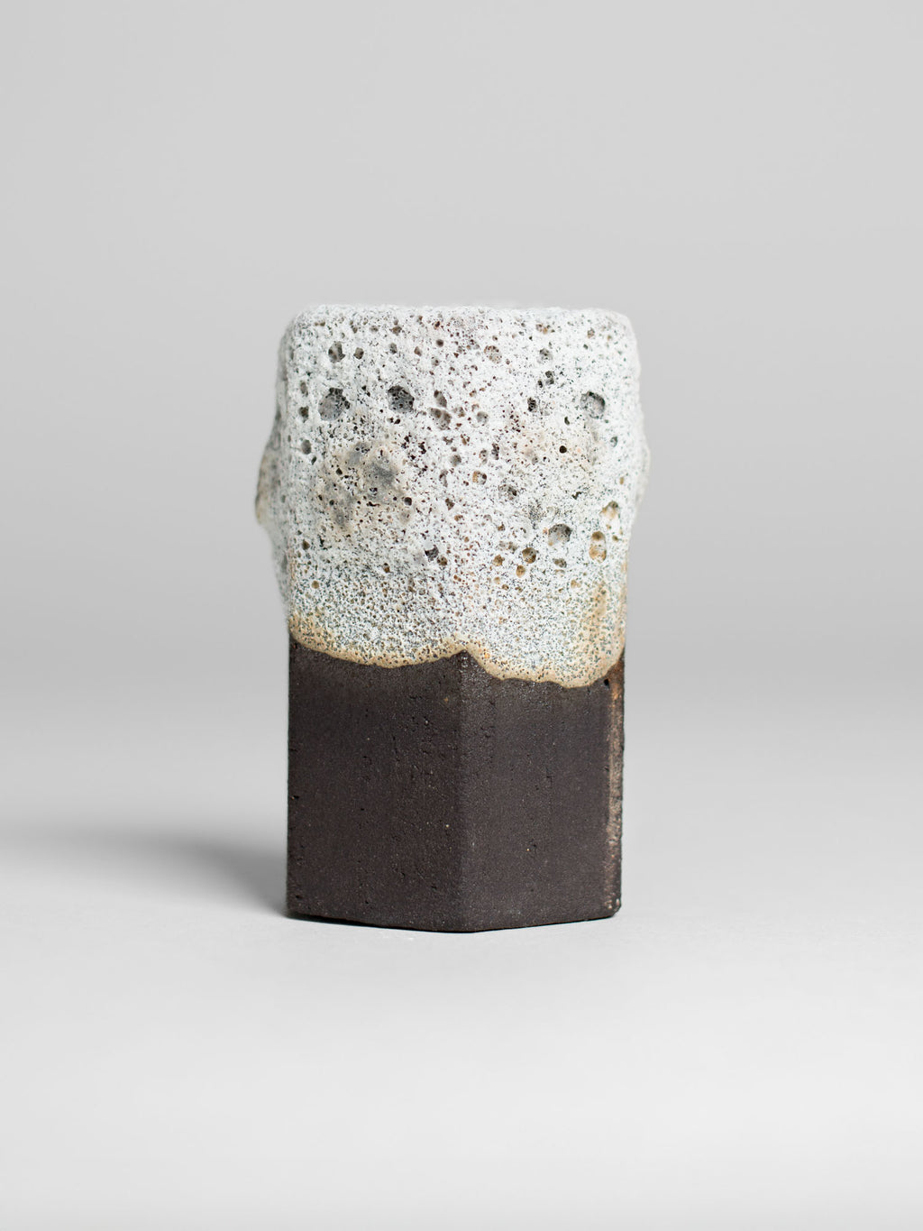 Ceramic piece featuring White Lava glaze with dimensional textures, designed for brush-on application in oxidation firing.