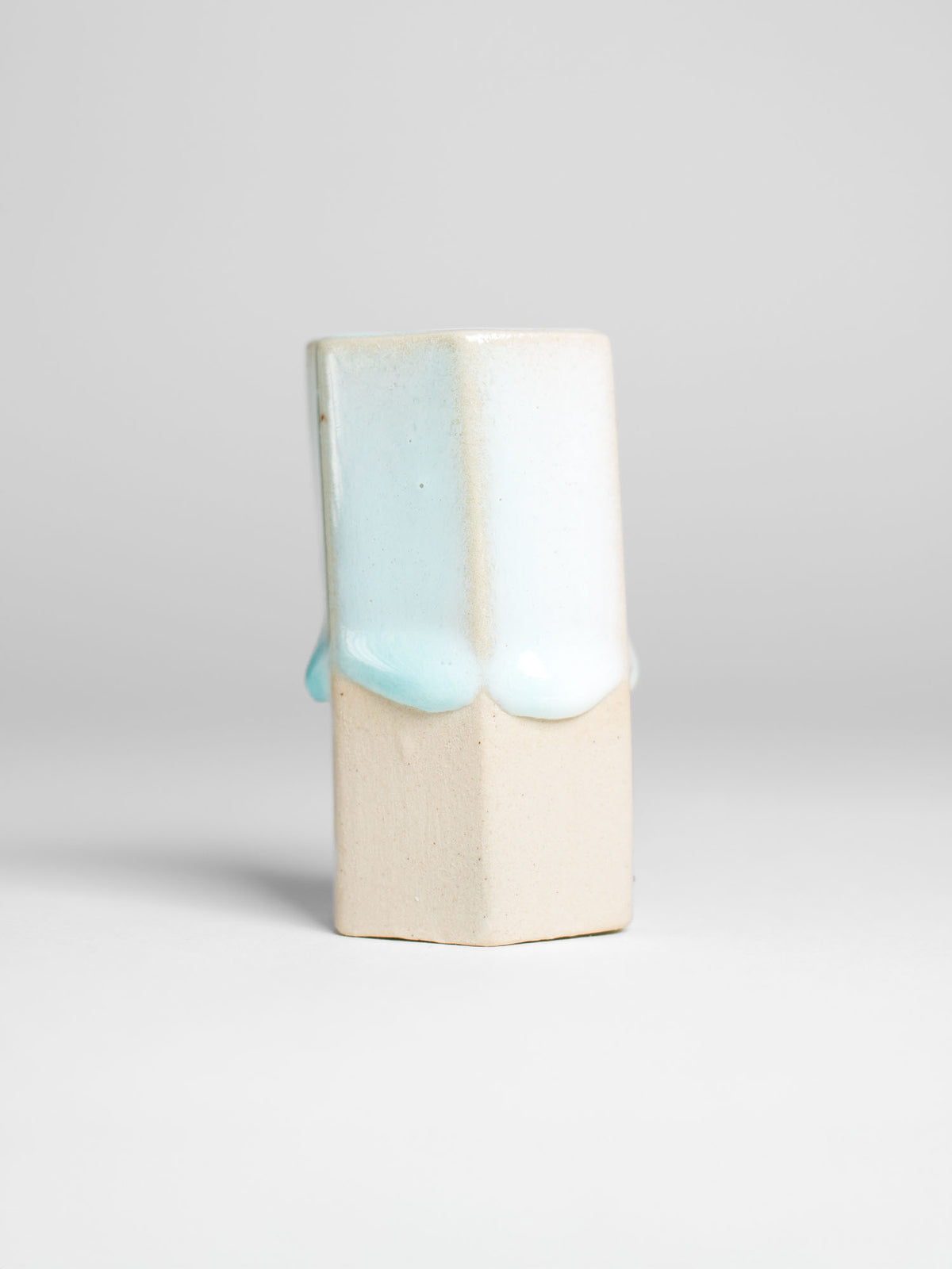 Snow Drift glaze demonstrating its glossy white finish and drippy texture, ideal for adding depth to coloured clay creations."