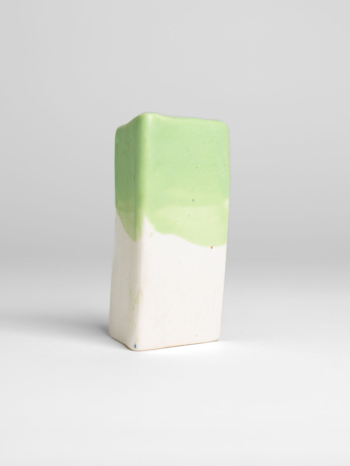 Salad Green Pastel Dreams glaze on a test tile, soft green matt over cream
