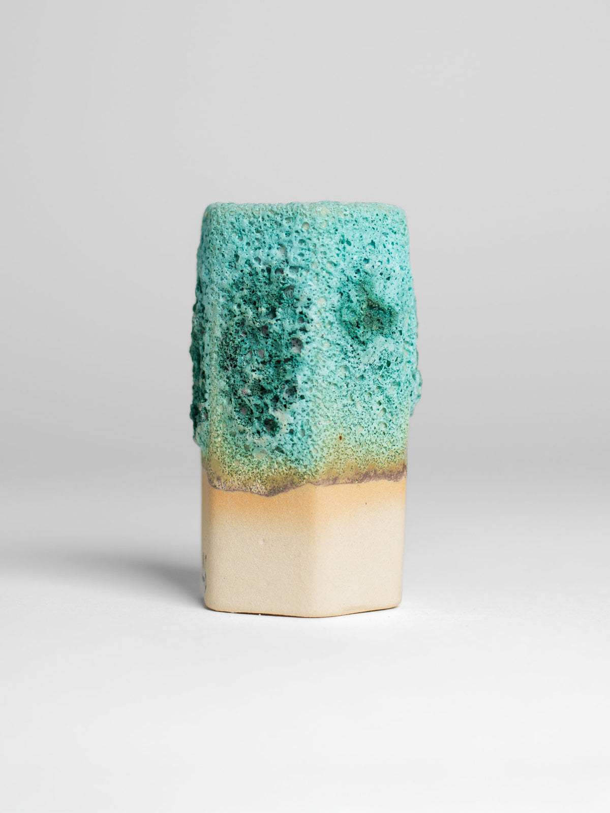 Sea Foam glaze applied to ceramics, creating dynamic textures and colours influenced by firing and layer thickness.