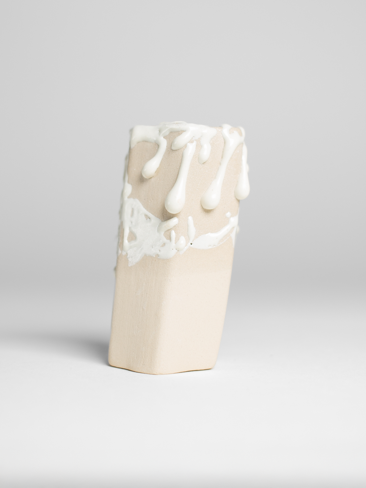 Crawl Textured White glaze on a pale fired test cylinder