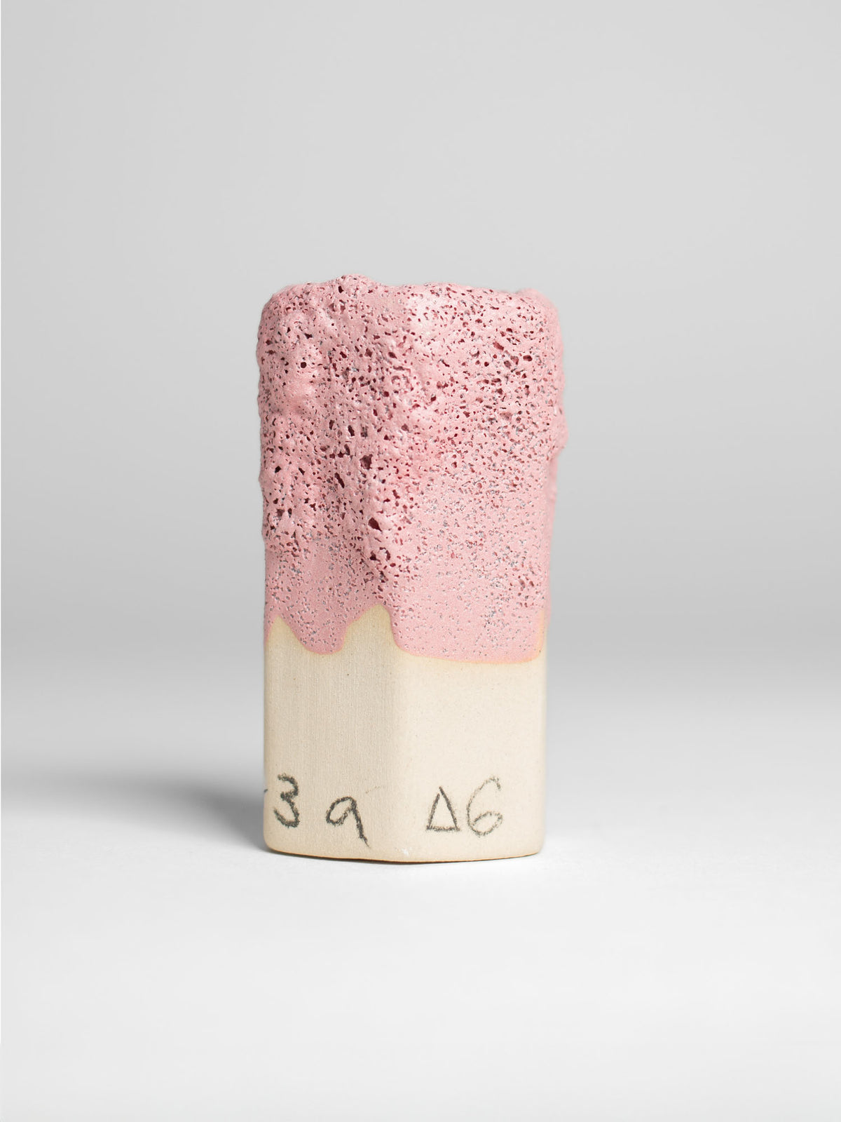 Pink Lava ceramic glaze applied on a surface, showcasing its lava-like textures and tonal variations from soft pink to deeper shades.
