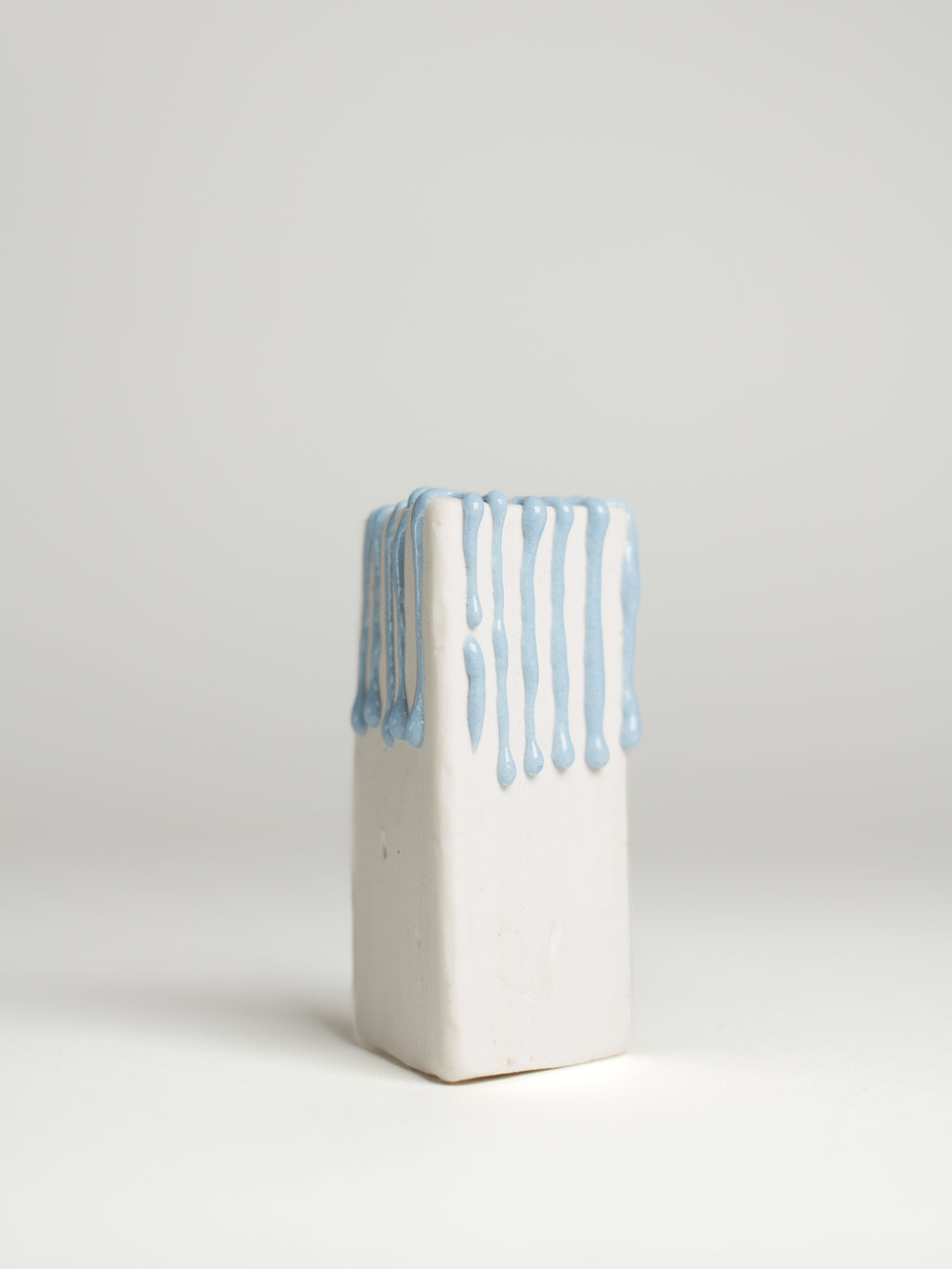 Light Blue Liquid Gloop on a white clay test tile