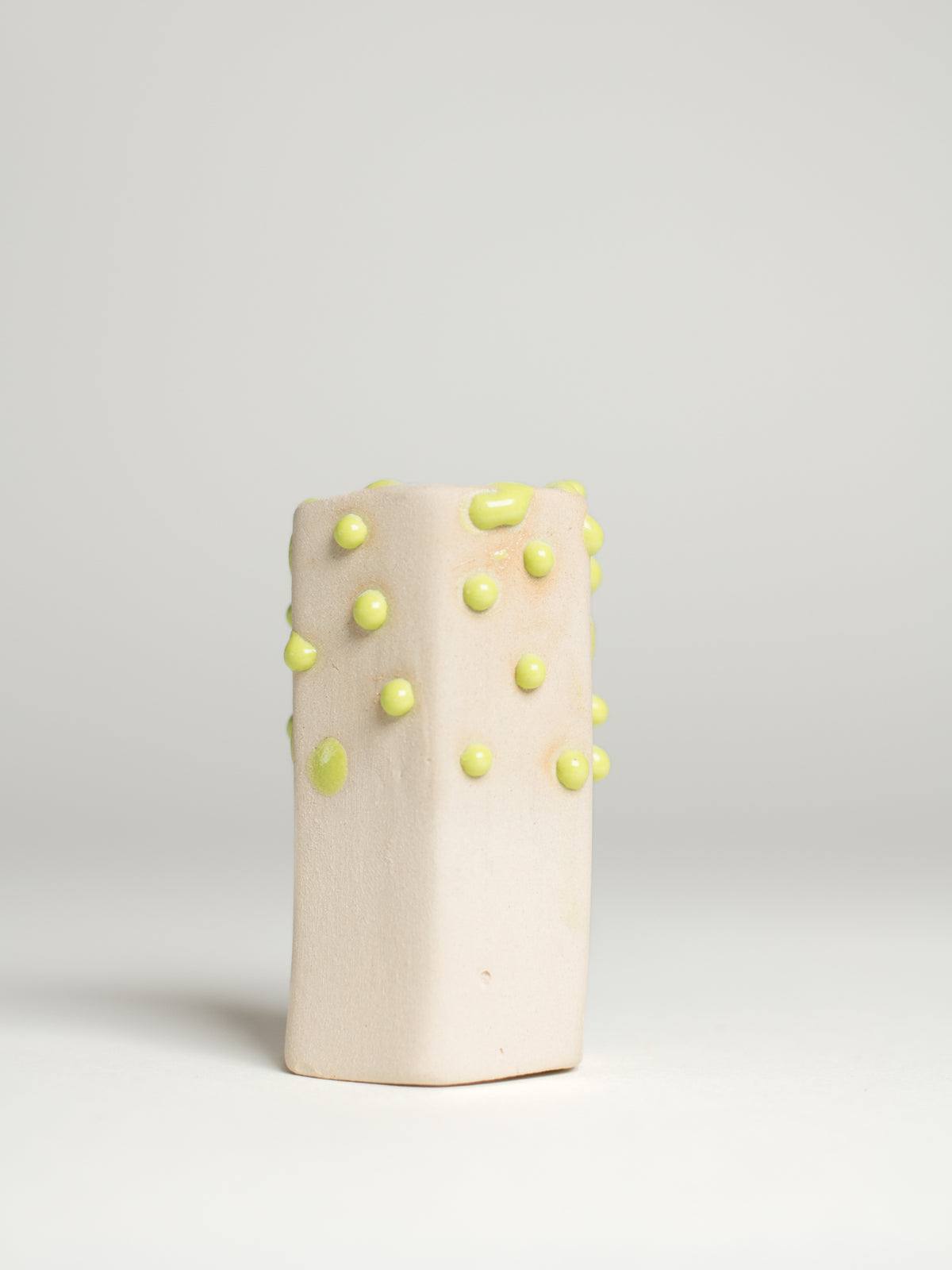Green Liquid Gloop on a pale fired test cylinder