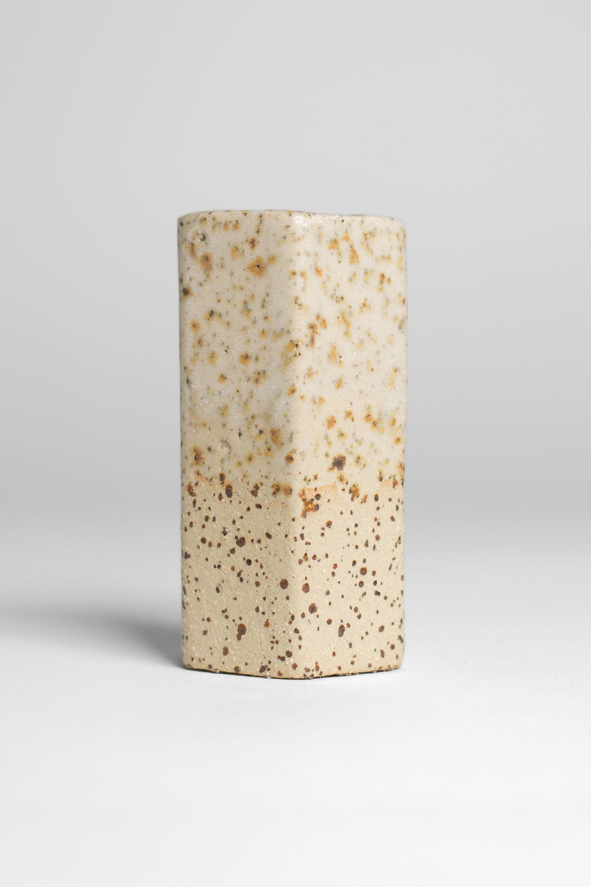 Milky Matt White glaze on a fired test cylinder, warm off white matt