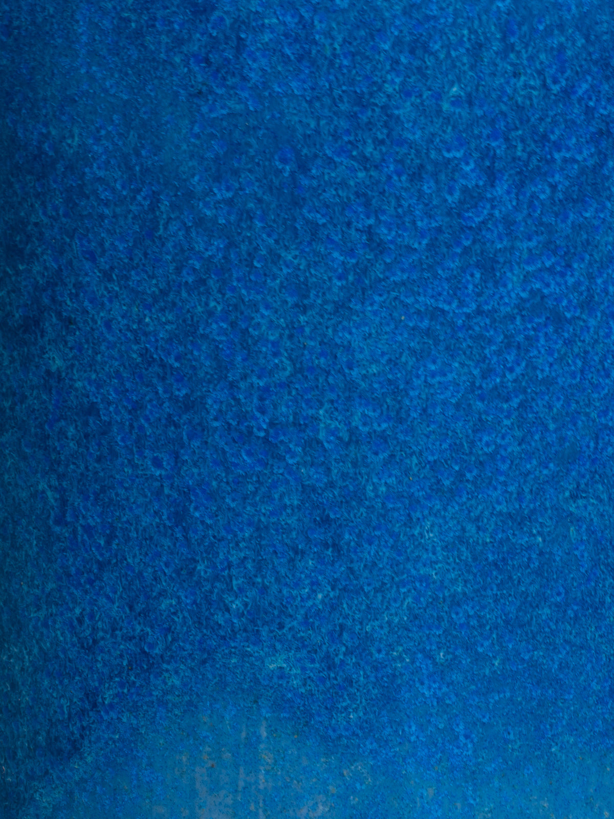 Close up of Frosty Blue Gloss, a deep blue glossy surface