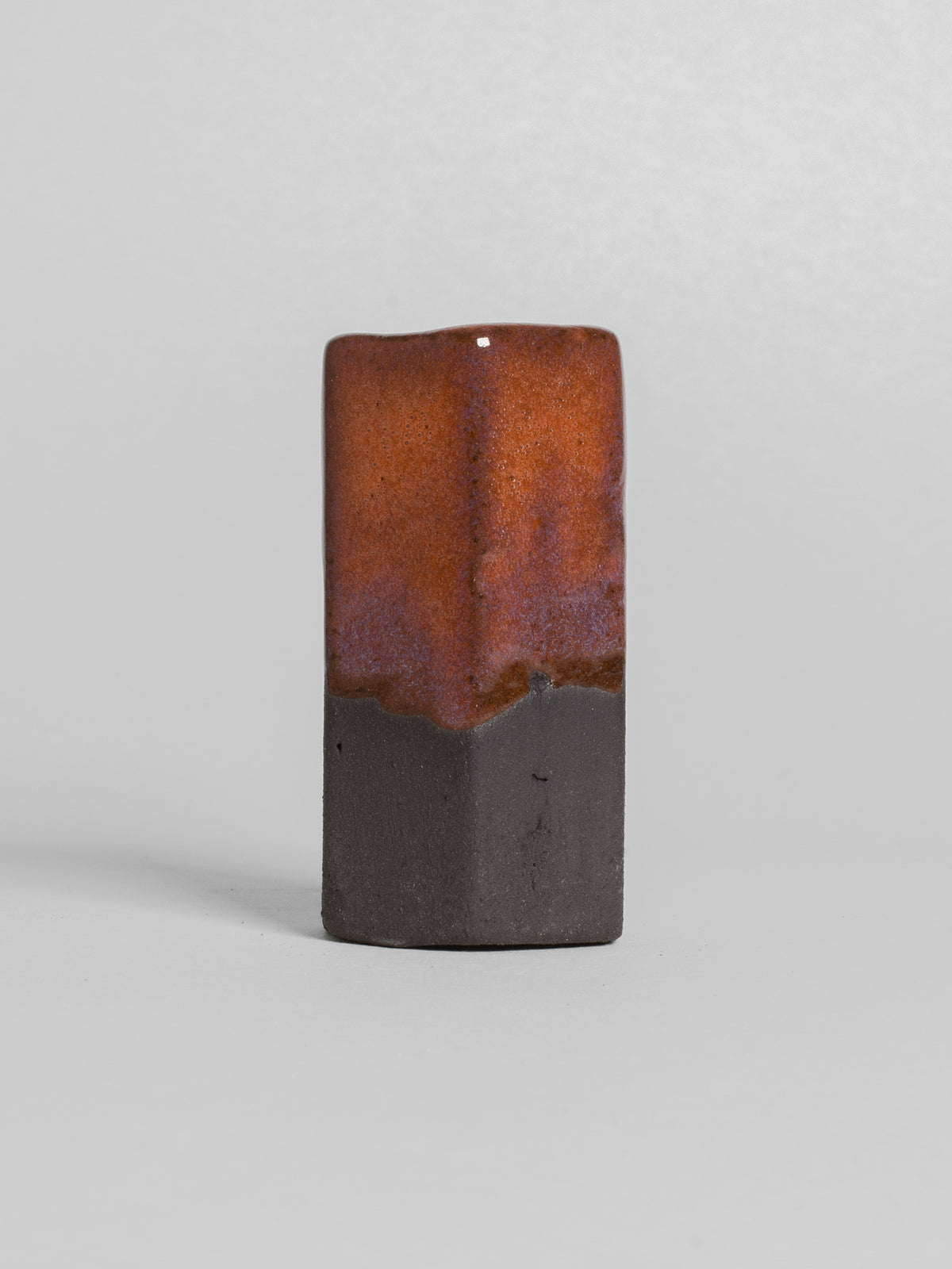 Peach glaze on black stoneware clay
