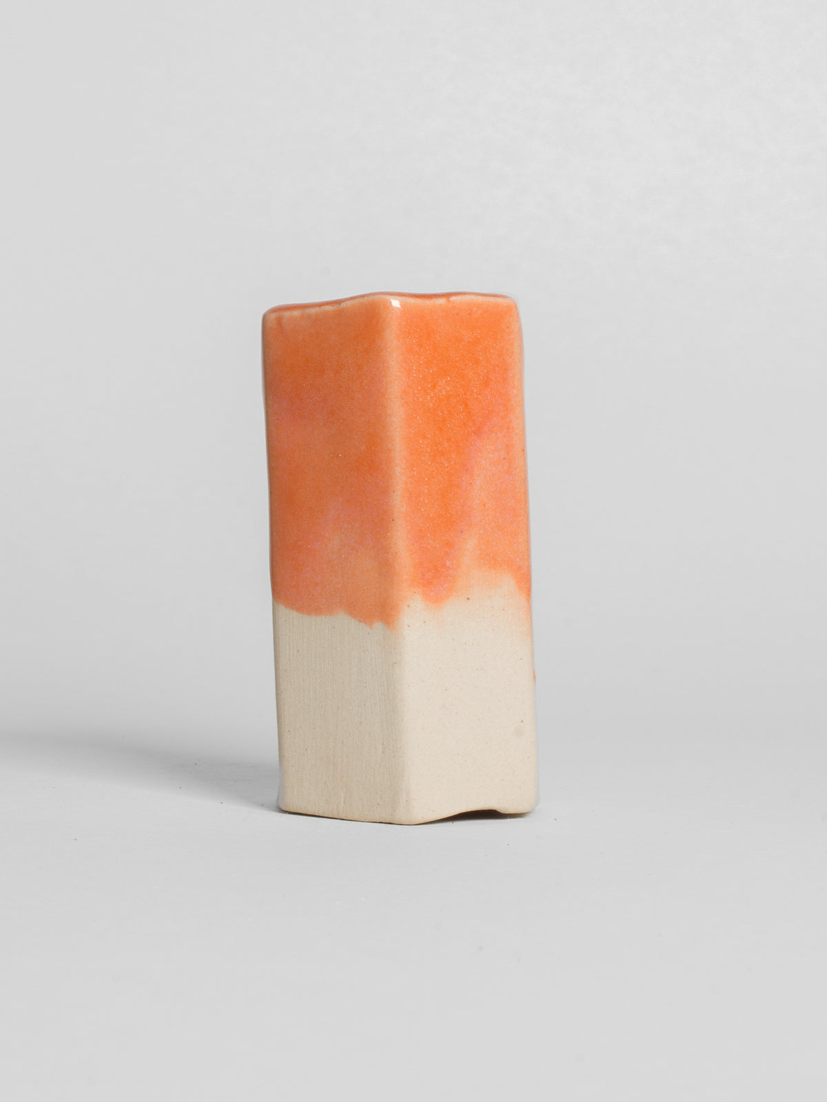 Peach glossy toneware pottery glaze. test tile