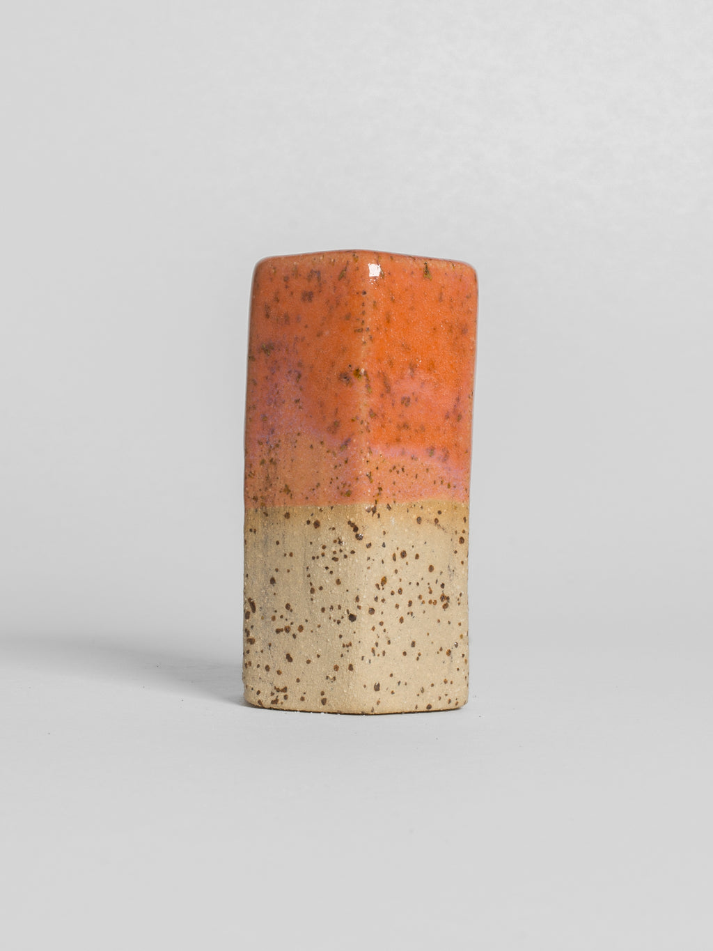 Peach glossy laze on a speckel stoneware clay body