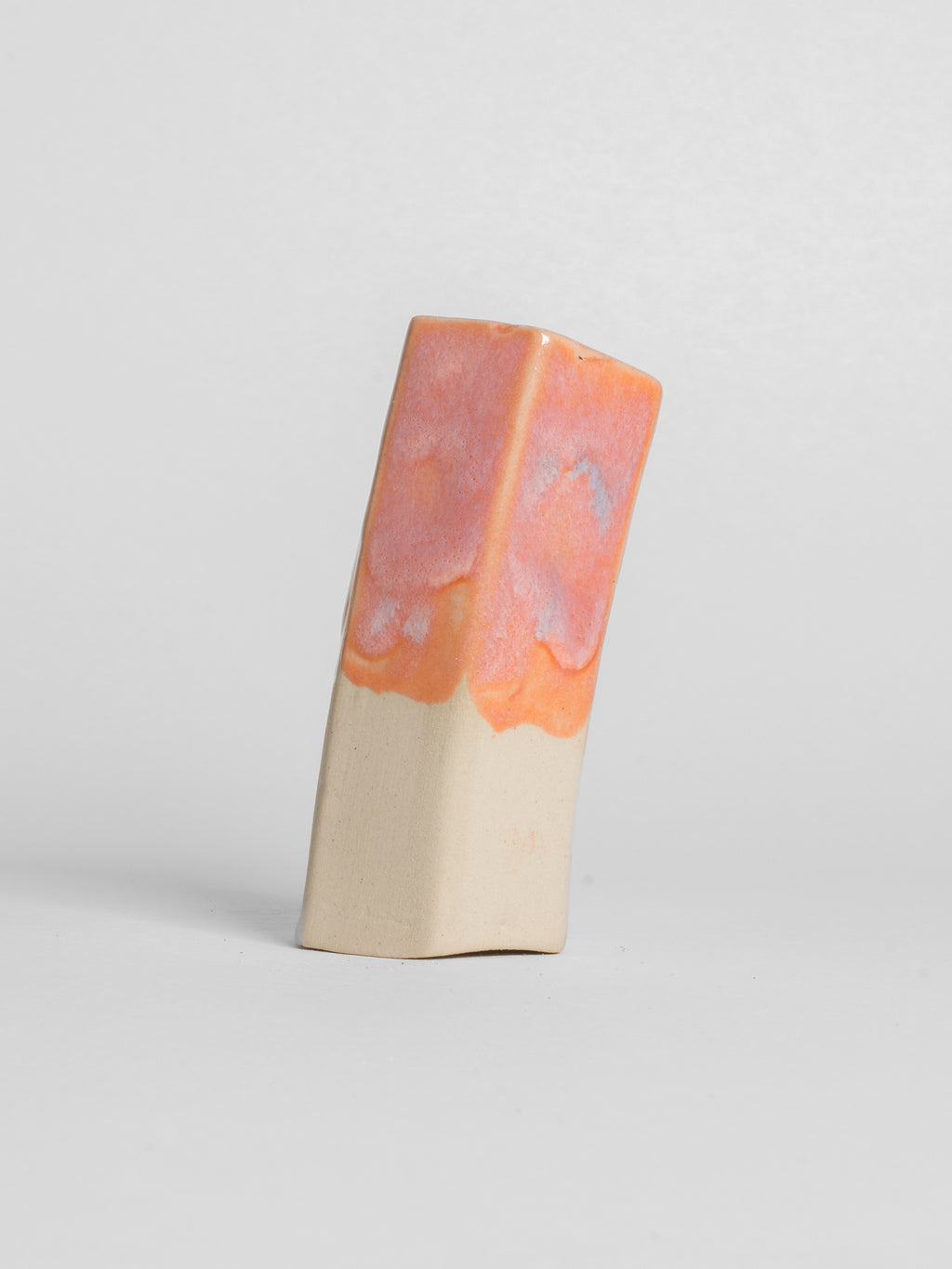 Peach shiny glaze on stoneware white clay