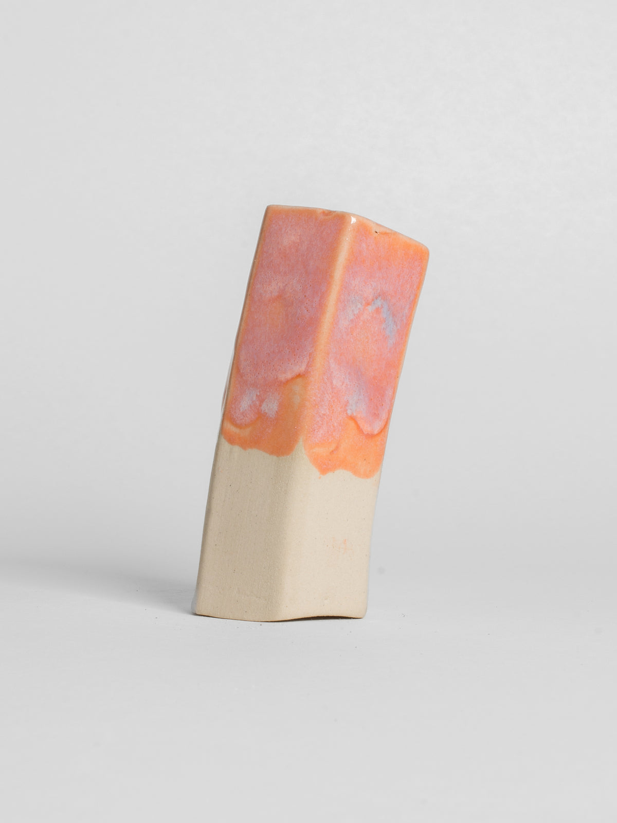 Peach shiny glaze on stoneware white clay
