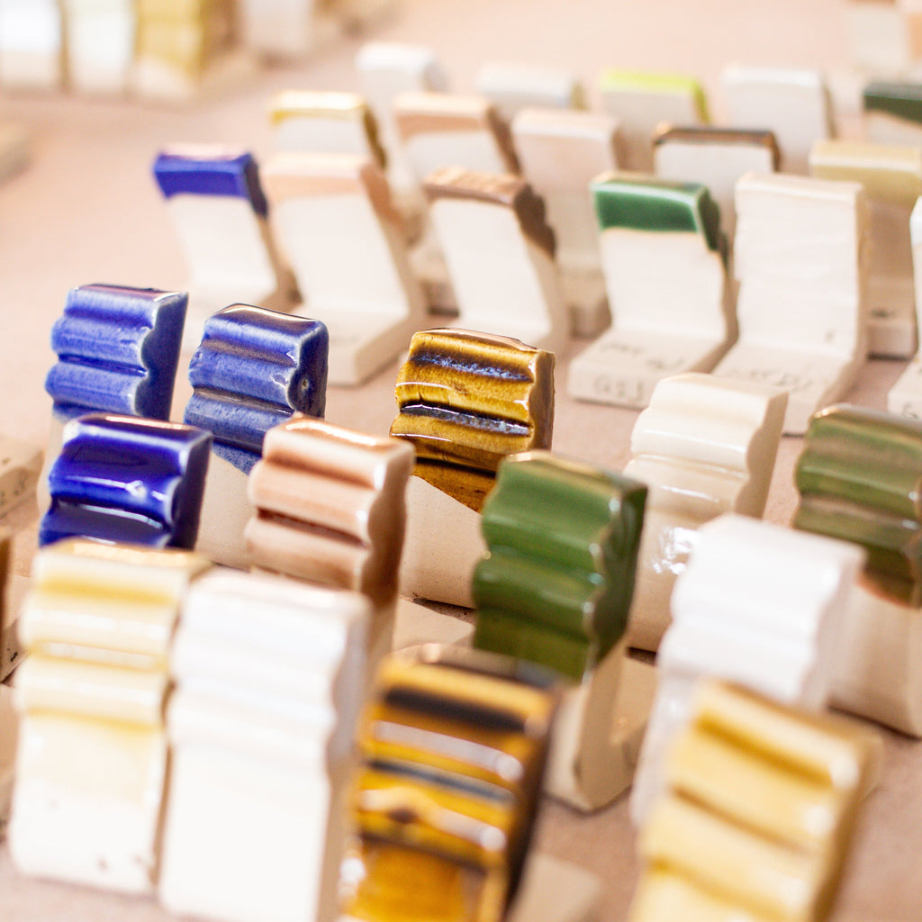 Three-day glaze-making workshop with materials and expert guidance, teaching participants to refine recipes and create custom glazes.