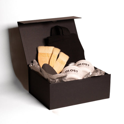 The ceramic glaze hamper, an open black box with glazes and tools inside