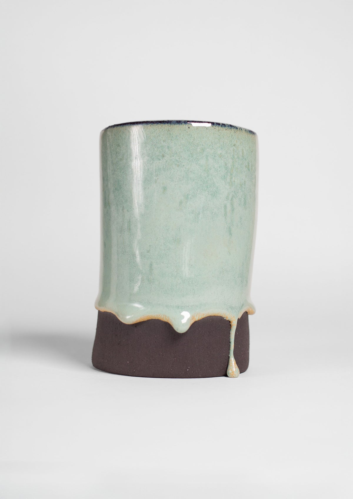 Jade Turquoise Gloss on a test cylinder, pale jade running darker at the foot