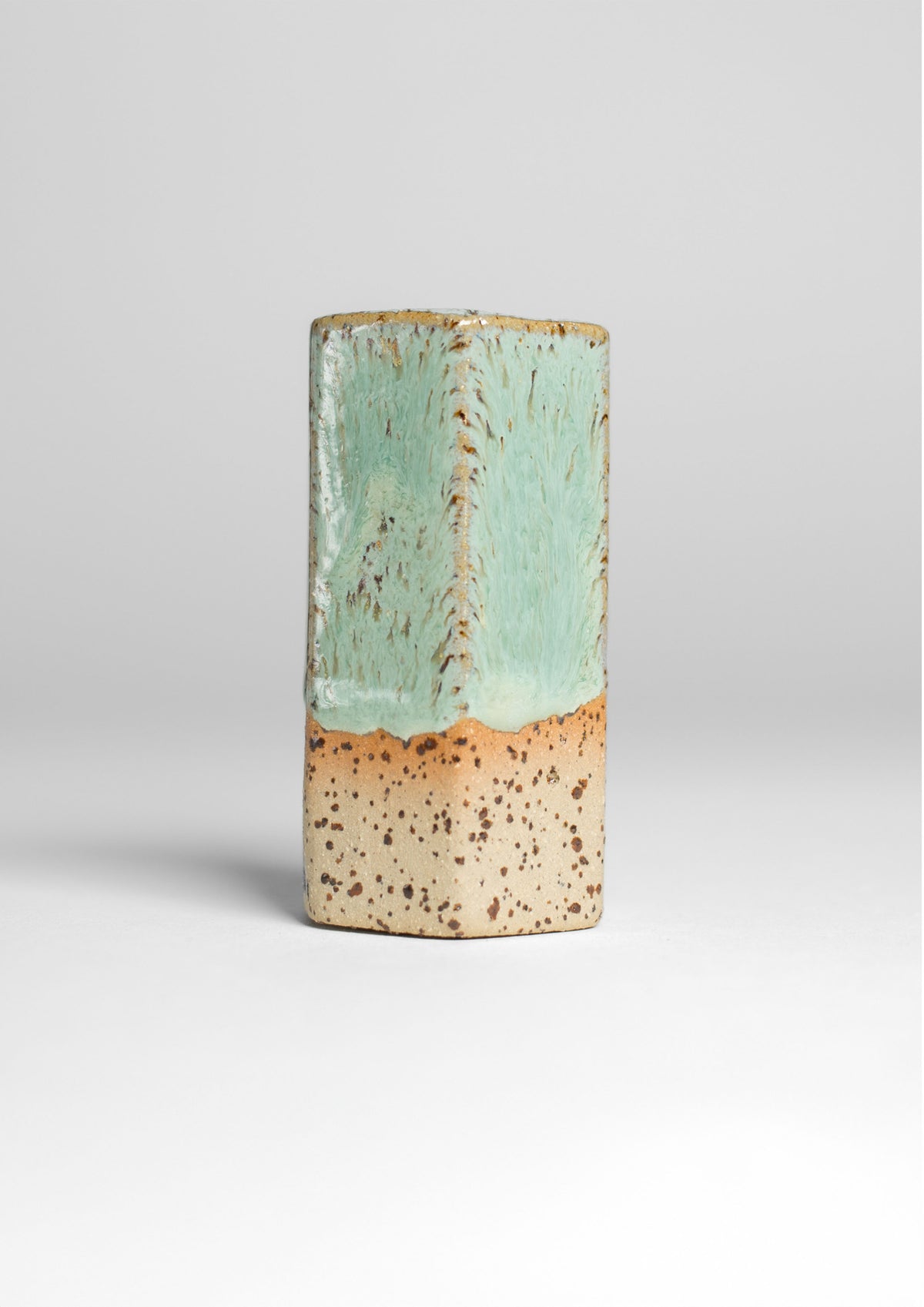 Jade Turquoise Gloss on a test tile, jade green over bare clay