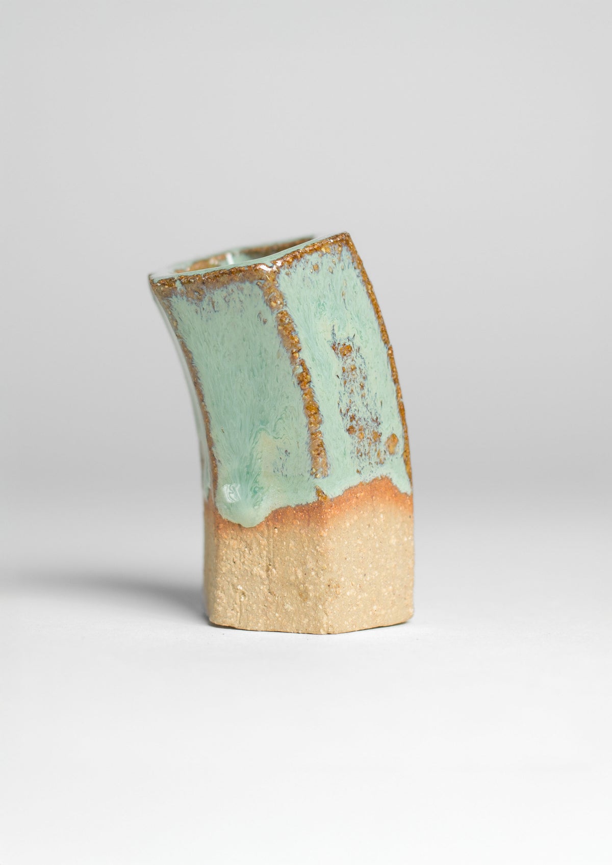 Jade Turquoise Gloss test tile propped against a wooden block
