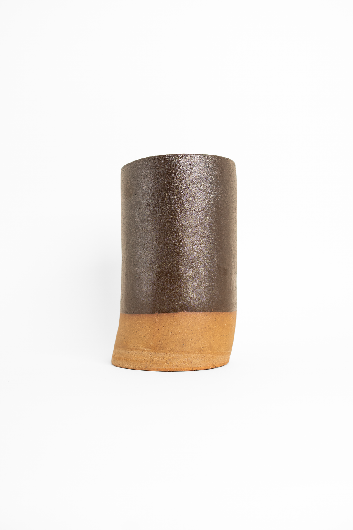 Silt Reclaimed Dark Brown glaze on a fired test cylinder