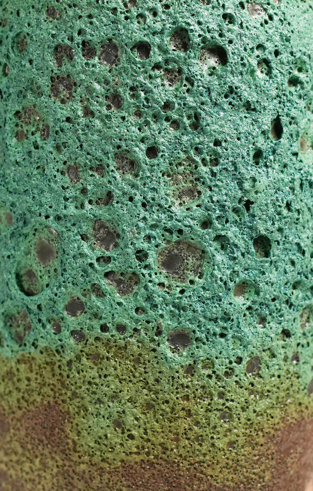 Close-up of a textured green lava glaze