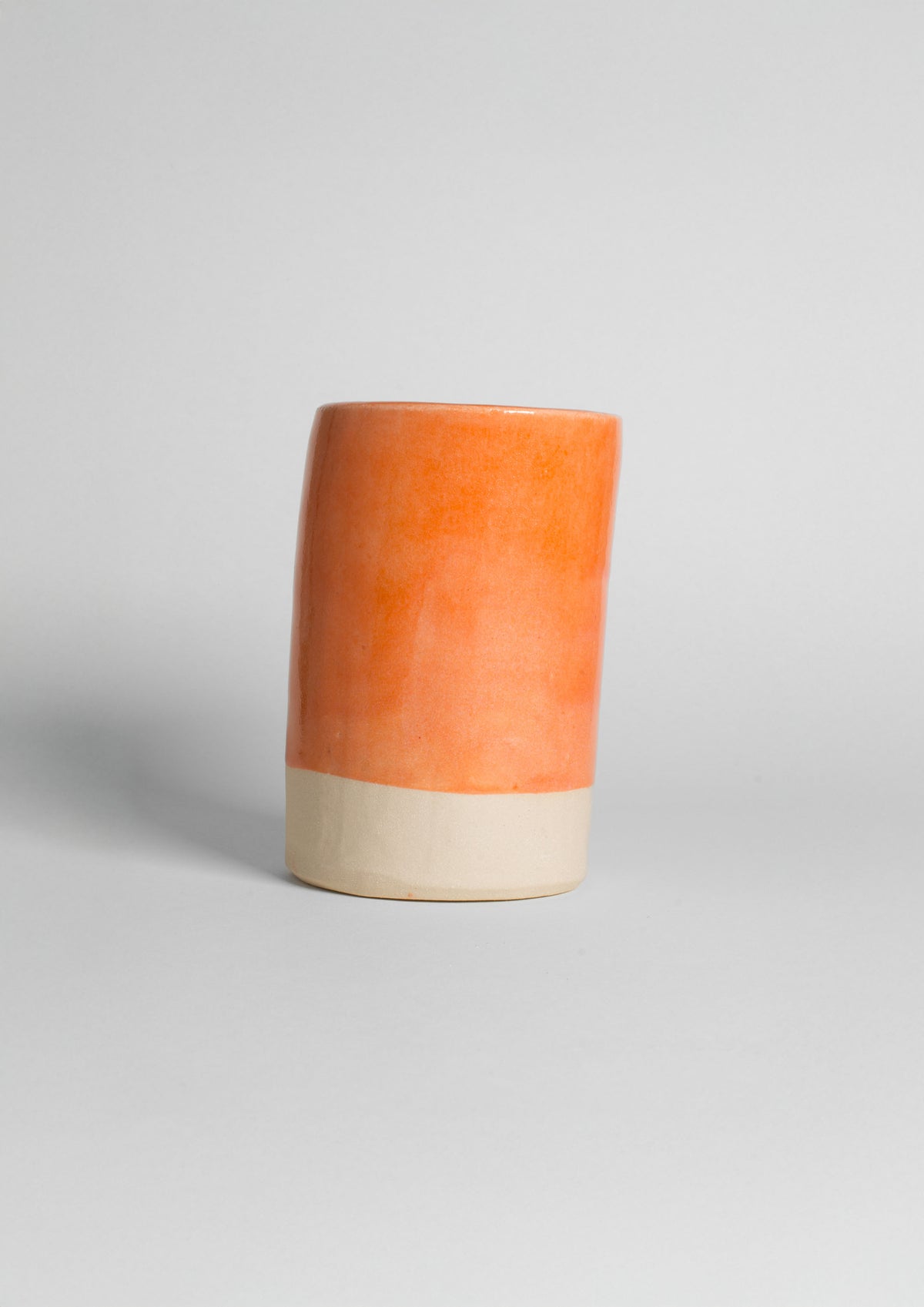Peach shiny glaze on stoneware clay 