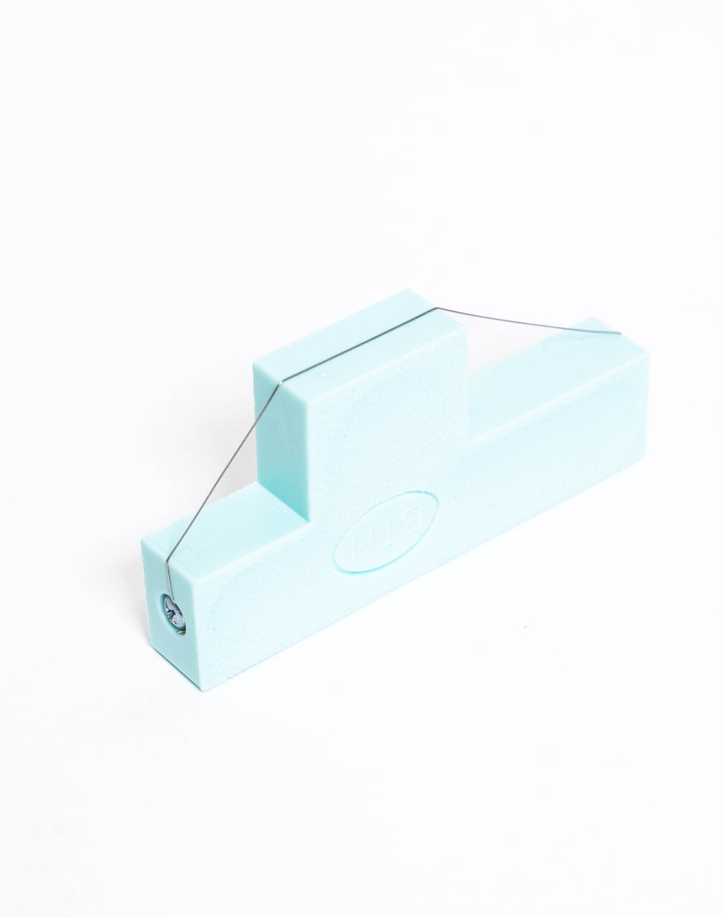 Pale blue bevel wire tool standing on end, wire stretched from the top step to the base