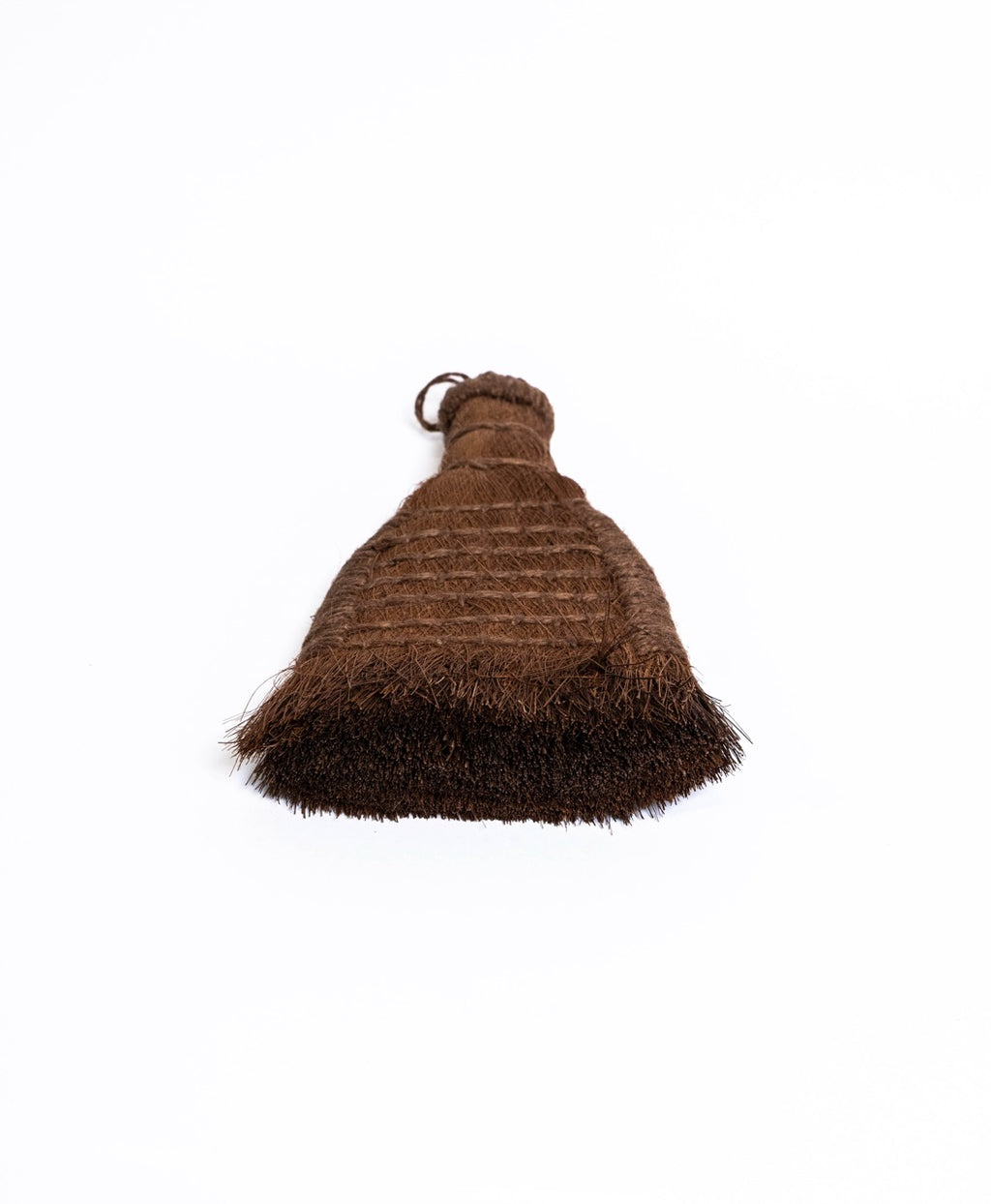 Flat fan palm fibre brush with a stitched panel, seen from above