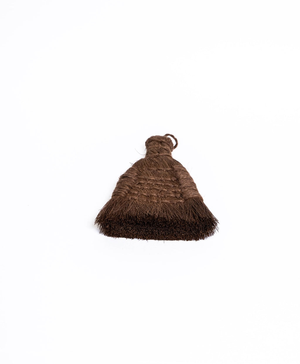Flat fan palm fibre brush with a stitched grid panel, bristle edge towards the camera