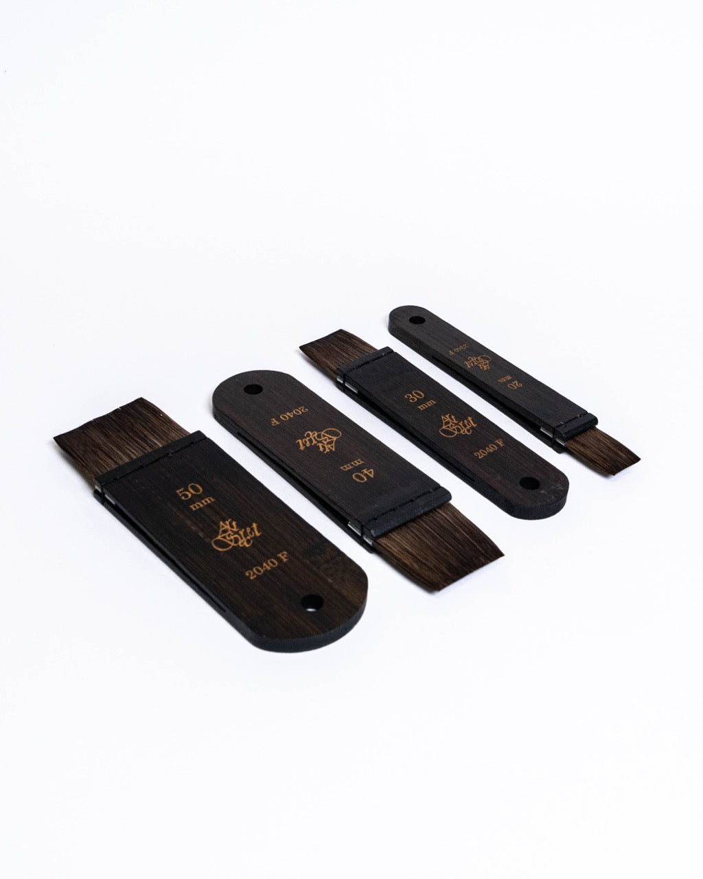 Flat brushes with dark wooden handles