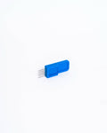 A blue plastic scoring tool with five fine steel pins, seen at an angle.