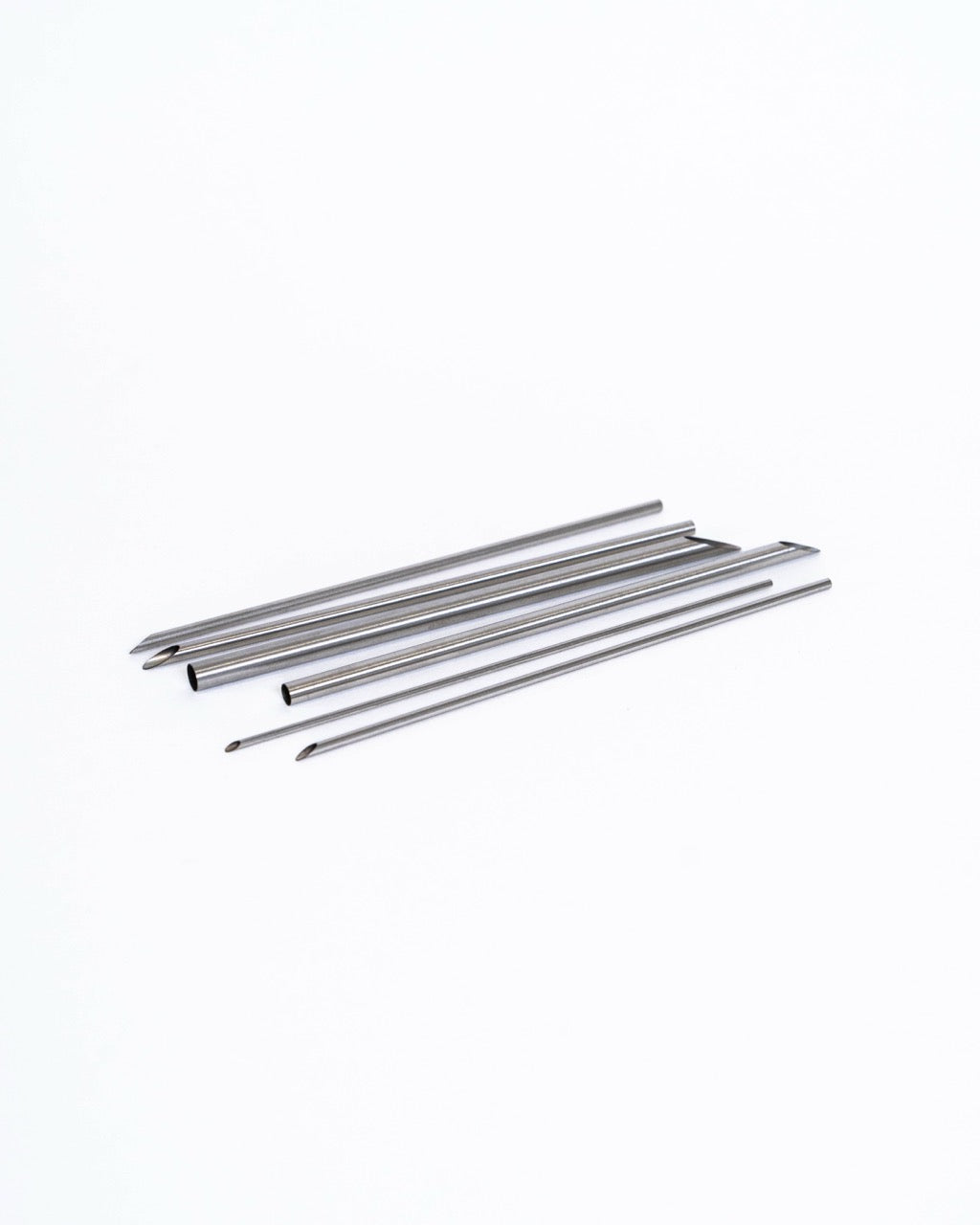 Hollow-tipped hole punching tools for clean round holes in clay, from GLOST