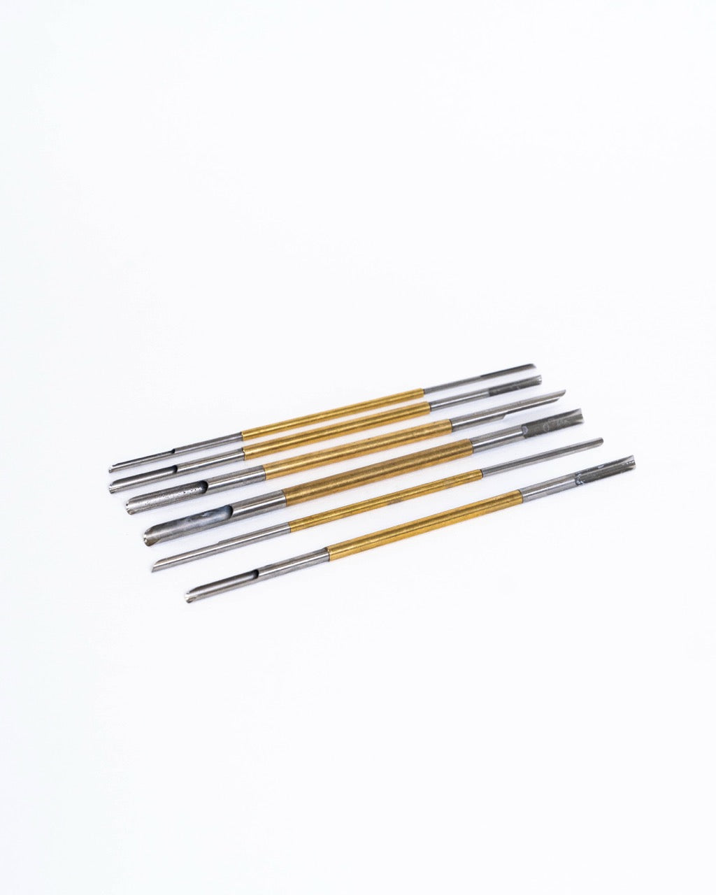 Hollow-tipped hole punching tools for clean round holes in clay, from GLOST