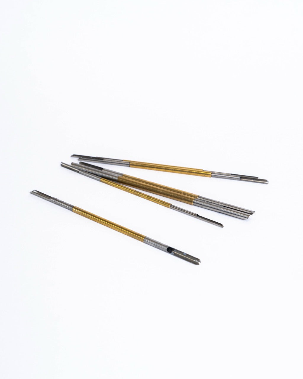 Hollow-tipped hole punching tools for clean round holes in clay, from GLOST