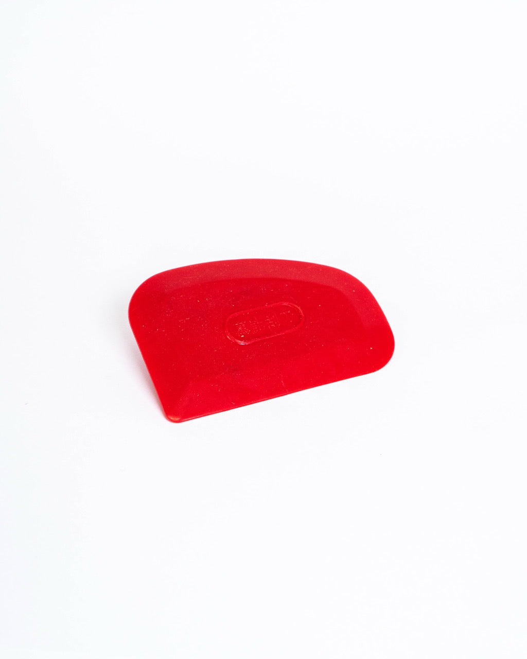 Red plastic rib, domed top with a straight working edge