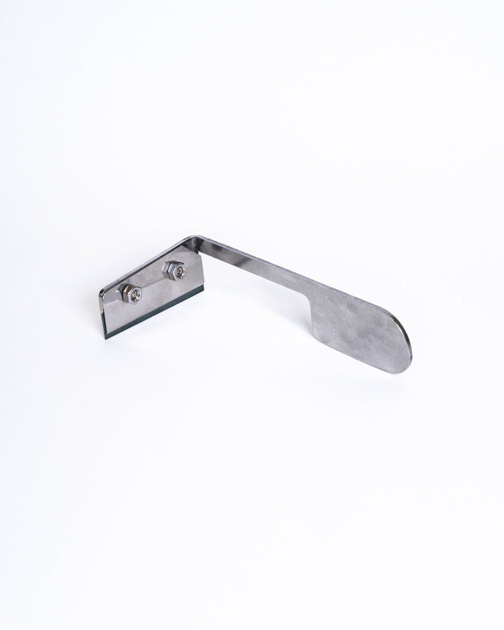 Flat steel knife on its own, showing the bolted blade clamp and the long flat handle