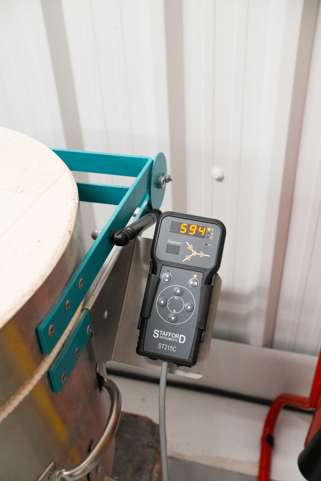 Pottery Kiln Controller next to a kiln