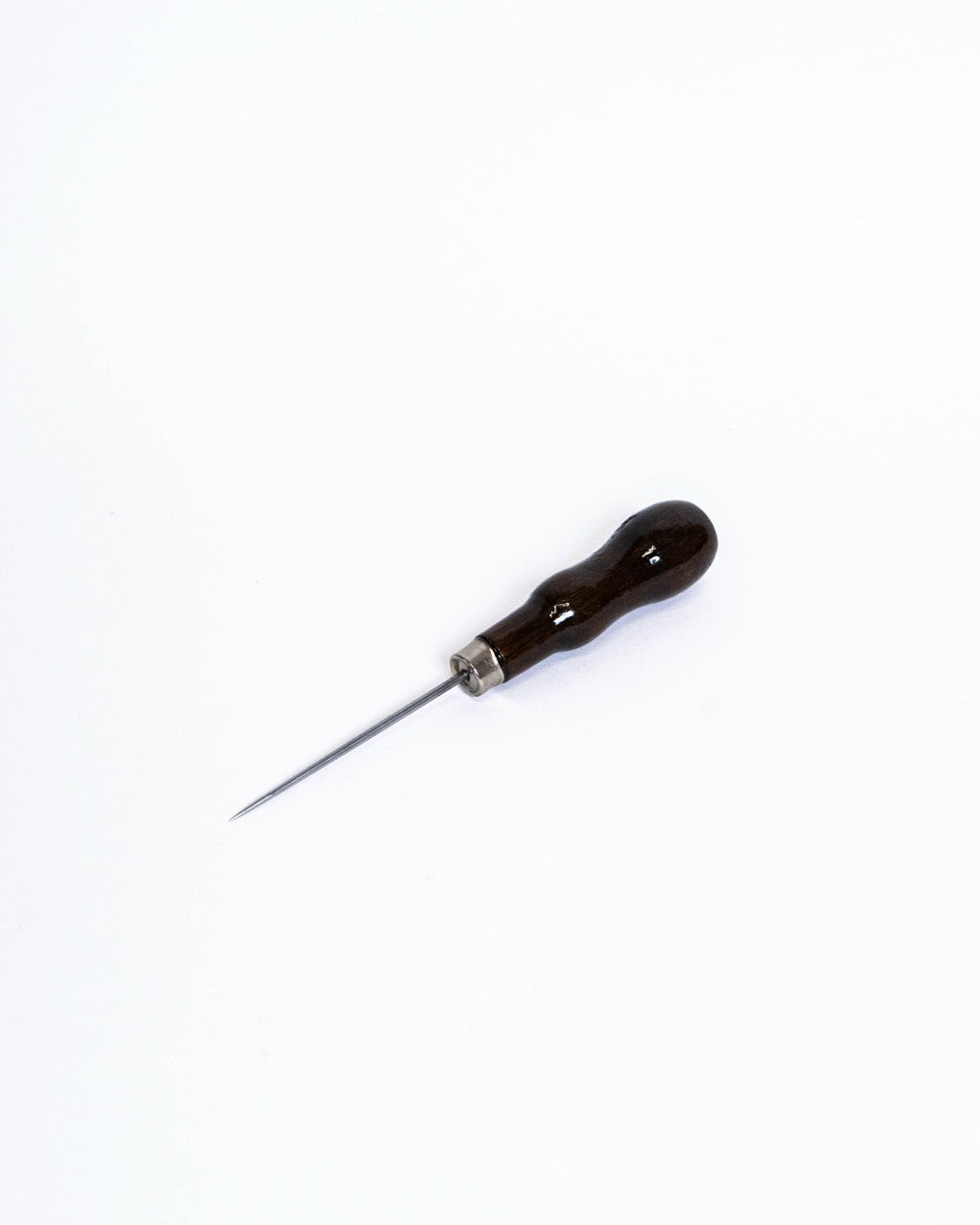 Pin tool with a dark curved wooden handle and metal ferrule, seen at an angle from above