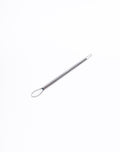 Metal loop trimming tool laid flat, teardrop loop at one end and a small round loop at the other