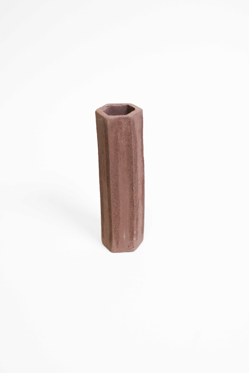 A tall faceted vessel in PF680 at the lower end of the range, matt red-brown and smooth