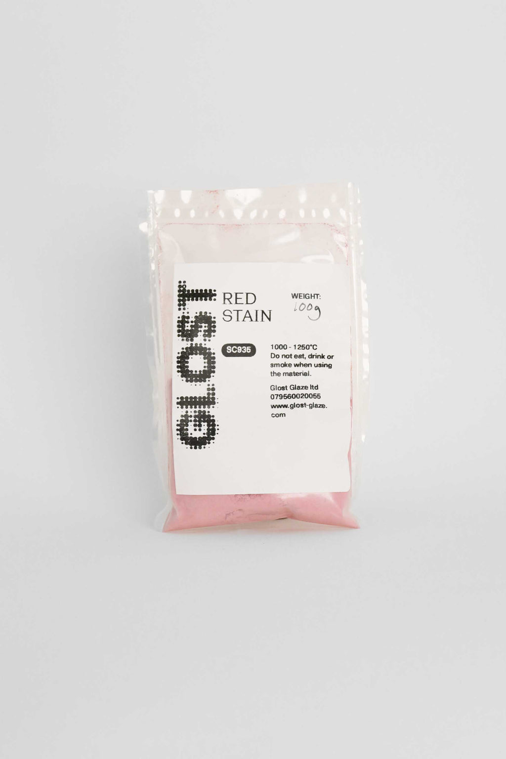 Red ceramic stain by GLOST Glaze, 100g sachet, for colouring glazes, slips, and clay bodies. Made in Britain.